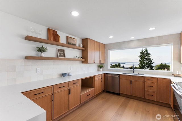 28830 11th Ave S, Federal Way, WA 98003 - kitchen featuring open shelves, stainless steel appliances, a sink, decorative backsplash, and light countertops