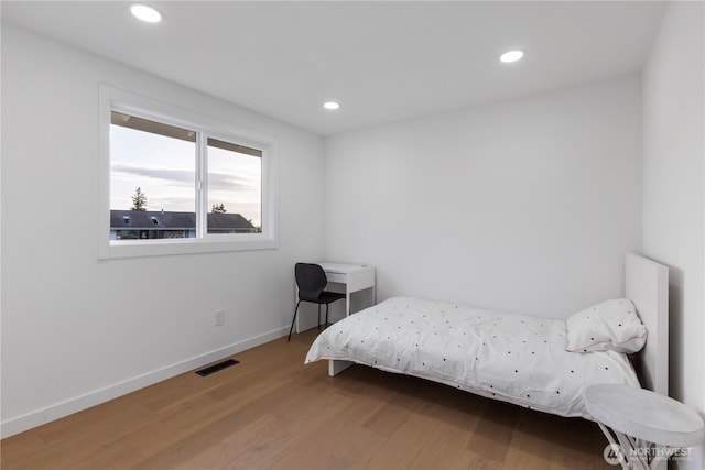 28830 11th Ave S, Federal Way, WA 98003 - bedroom featuring wood finished floors, recessed lighting, and baseboards