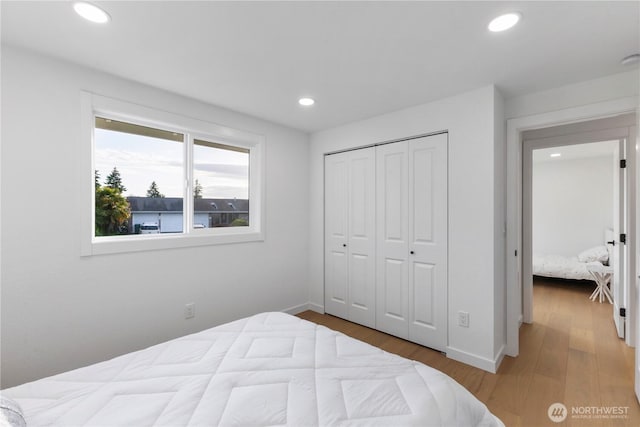 28830 11th Ave S, Federal Way, WA 98003 - bedroom with recessed lighting, wood finished floors, baseboards, and a closet