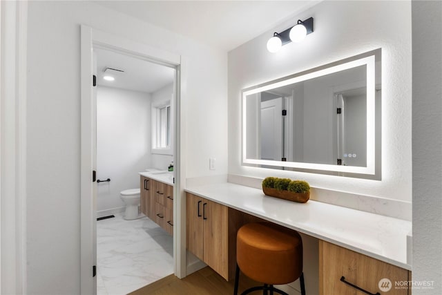 28830 11th Ave S, Federal Way, WA 98003 - bathroom with vanity, toilet, and marble finish flooring