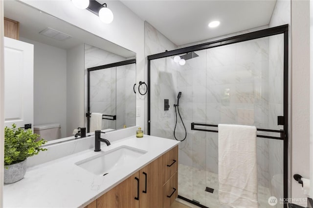 28830 11th Ave S, Federal Way, WA 98003 - full bath featuring toilet, vanity, a marble finish shower, and recessed lighting