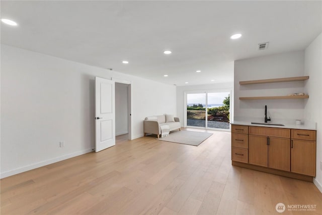 28830 11th Ave S, Federal Way, WA 98003 - living area with light wood finished floors, recessed lighting, wet bar, and baseboards