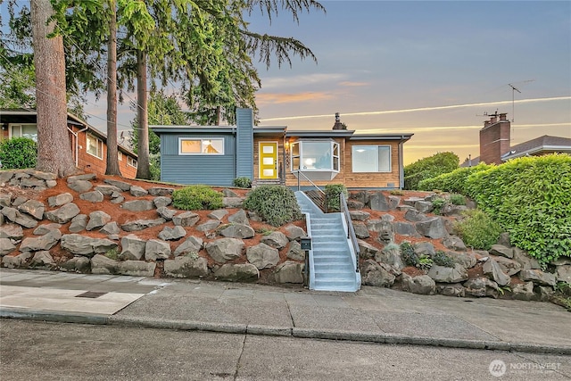 10209 65th Ave S, Seattle, WA 98178 - mid-century inspired home featuring stairs and a chimney