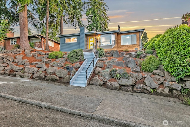 10209 65th Ave S, Seattle, WA 98178 - view of front of property with a chimney and stairway