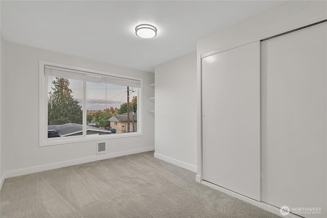 10209 65th Ave S, Seattle, WA 98178 - unfurnished bedroom with baseboards, carpet, and a closet