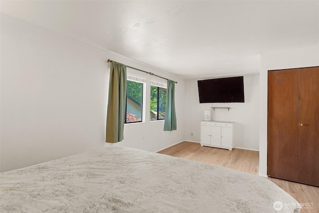 1801 Evergreen Park Ct SW Unit 8, Olympia, WA 98502 - unfurnished bedroom featuring light wood-style flooring and baseboards