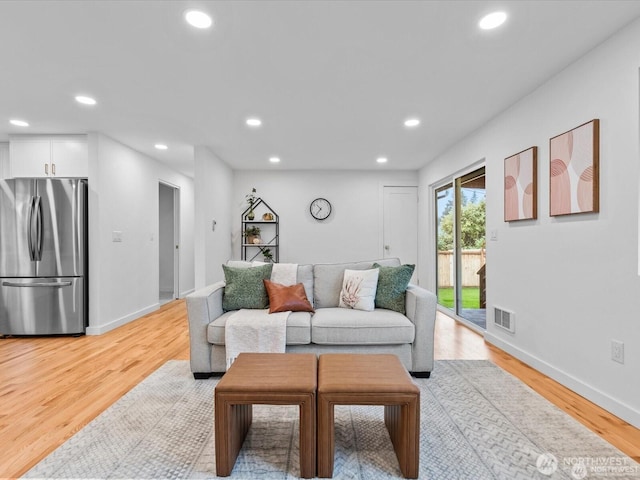 8421 240th St SW, Edmonds, WA 98020 - living room featuring recessed lighting, light wood-style floors, and baseboards
