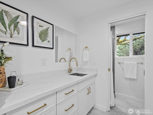 8421 240th St SW, Edmonds, WA 98020 - full bath with vanity, baseboards, and marble look tile flooring