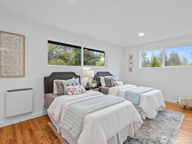 8421 240th St SW, Edmonds, WA 98020 - bedroom featuring multiple windows, baseboards, wood finished floors, heating unit, and recessed lighting