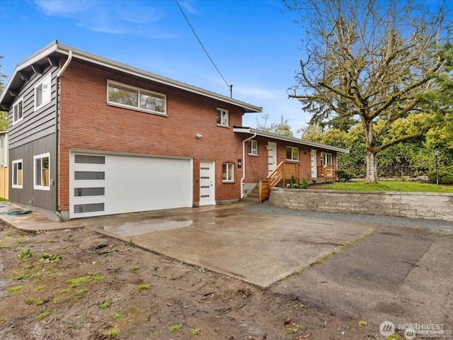 8421 240th St SW, Edmonds, WA 98020 - view of front of property featuring a garage, driveway, and brick siding
