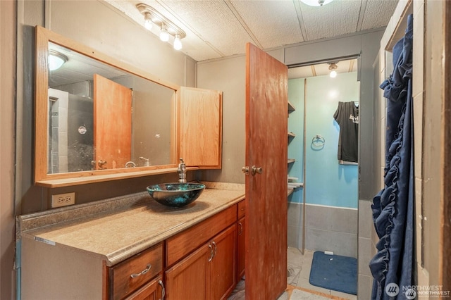 7503 189th Street Ct E Unit 12, Puyallup, WA 98375 - bathroom featuring vanity, a wainscoted wall, and tile patterned floors