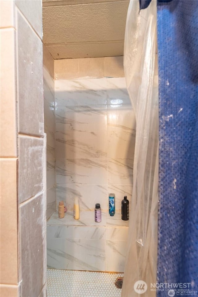 7503 189th Street Ct E Unit 12, Puyallup, WA 98375 - bathroom featuring tile patterned floors and tiled shower