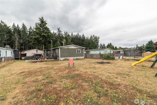 7503 189th Street Ct E Unit 12, Puyallup, WA 98375 - view of yard featuring a trampoline and a playground