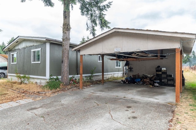 7503 189th Street Ct E Unit 12, Puyallup, WA 98375 - view of side of property featuring a carport and driveway