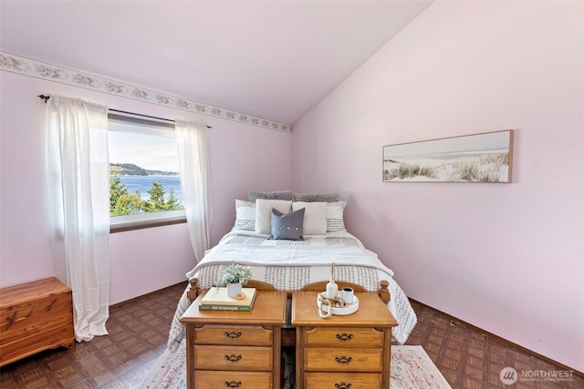 10601 87th Ct, Anderson Island, WA 98303 - bedroom featuring vaulted ceiling and baseboards