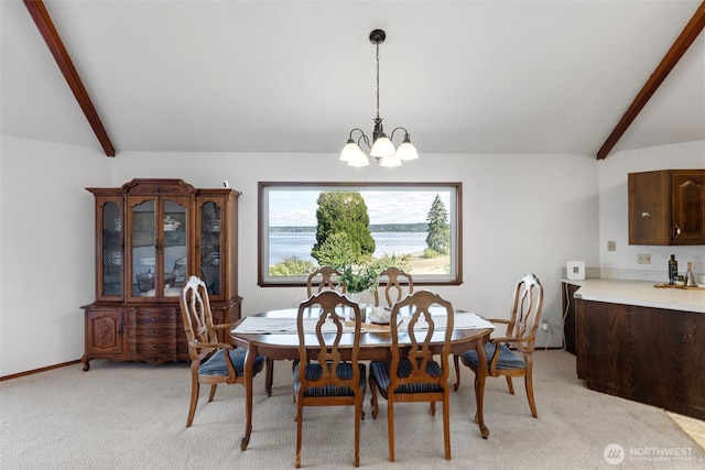 10601 87th Ct, Anderson Island, WA 98303 - dining room featuring light colored carpet and a chandelier