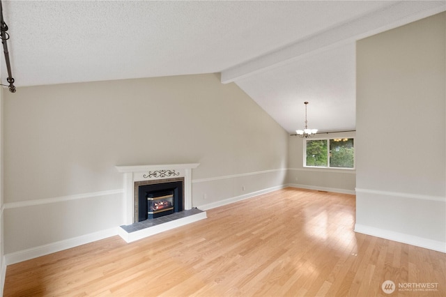 33205 32nd Pl SW, Federal Way, WA 98023 - unfurnished living room with light wood finished floors, a tiled fireplace, a chandelier, and baseboards