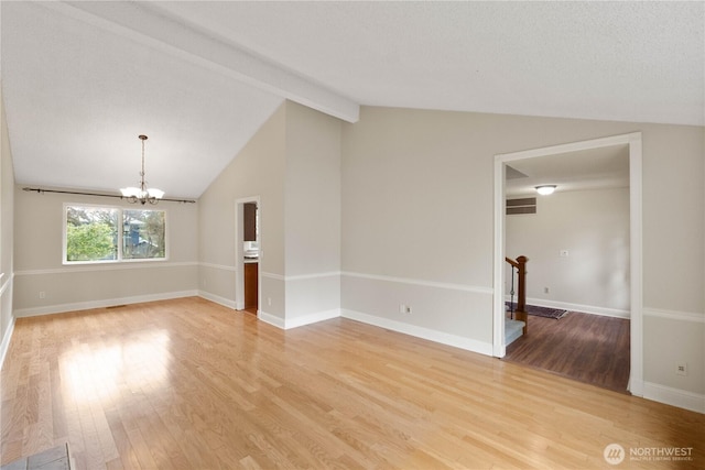 33205 32nd Pl SW, Federal Way, WA 98023 - spare room with light wood finished floors, a chandelier, and baseboards