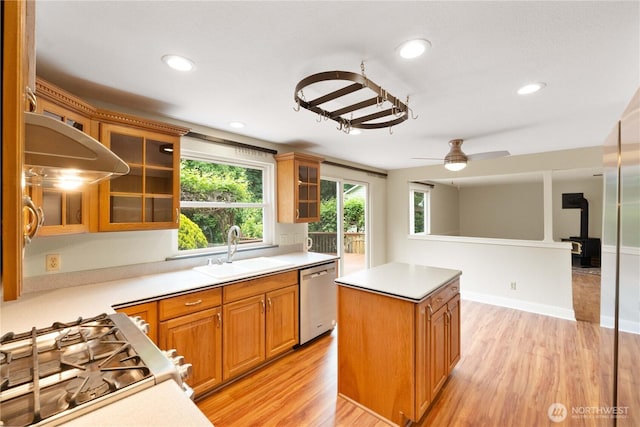 33205 32nd Pl SW, Federal Way, WA 98023 - kitchen with dishwasher, a sink, light wood-style flooring, light countertops, and a kitchen island