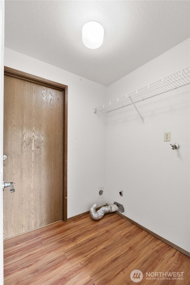 33205 32nd Pl SW, Federal Way, WA 98023 - laundry area with light wood-style floors, baseboards, and electric dryer hookup