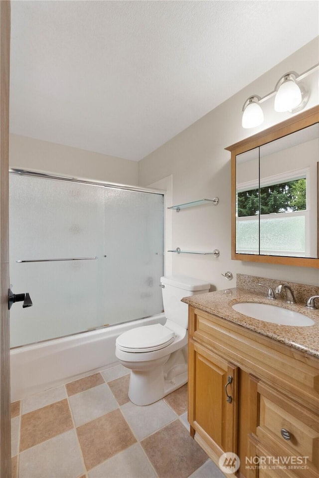 33205 32nd Pl SW, Federal Way, WA 98023 - full bath featuring vanity, toilet, and combined bath / shower with glass door