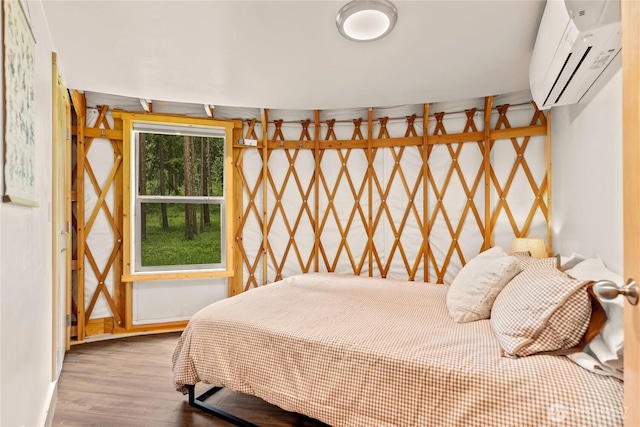 39 Ulrich Ln, Mazama, WA 98833 - bedroom featuring an AC wall unit, wood finished floors, and baseboards