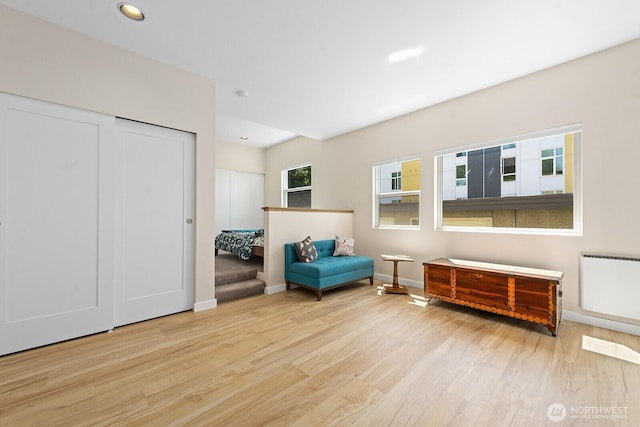 4530 Meridian Ave N Unit S4, Seattle, WA 98103 - living area featuring wood finished floors, radiator, and recessed lighting