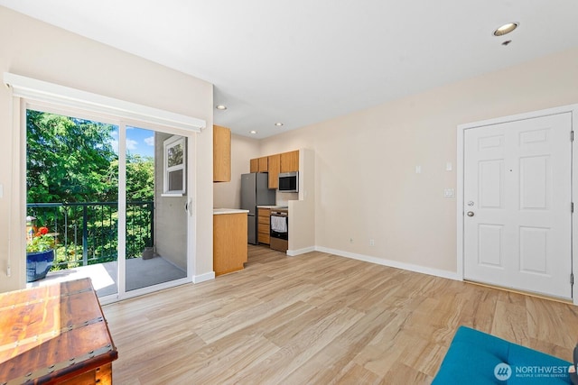 4530 Meridian Ave N Unit S4, Seattle, WA 98103 - unfurnished living room with light wood finished floors and recessed lighting