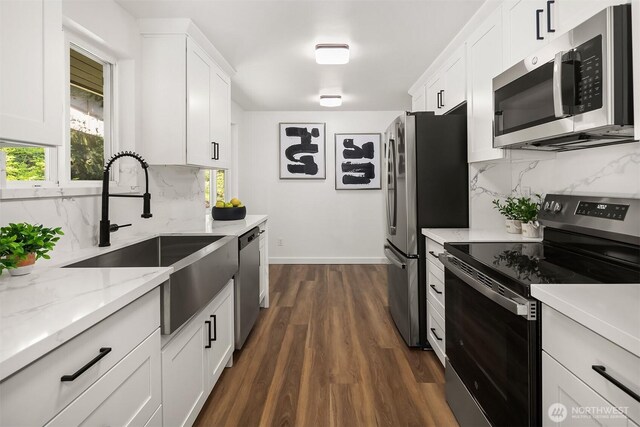 1136 N 146th Pl, Shoreline, WA 98133 - kitchen featuring appliances with stainless steel finishes, a sink, decorative backsplash, dark wood-style floors, and white cabinets