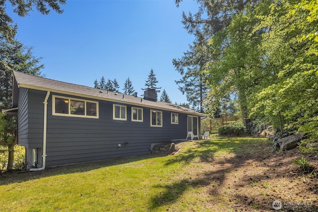1136 N 146th Pl, Shoreline, WA 98133 - back of house featuring a chimney and a yard