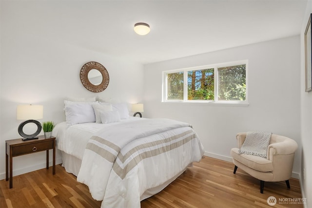 1136 N 146th Pl, Shoreline, WA 98133 - bedroom with baseboards and wood finished floors