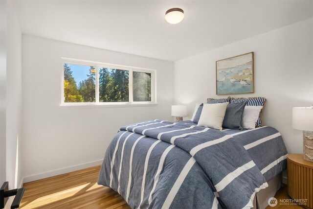 1136 N 146th Pl, Shoreline, WA 98133 - bedroom featuring wood finished floors and baseboards