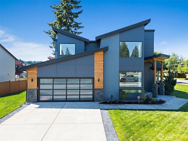 10501 Angeline Rd E, Bonney Lake, WA 98391 - contemporary home featuring stone siding and concrete driveway