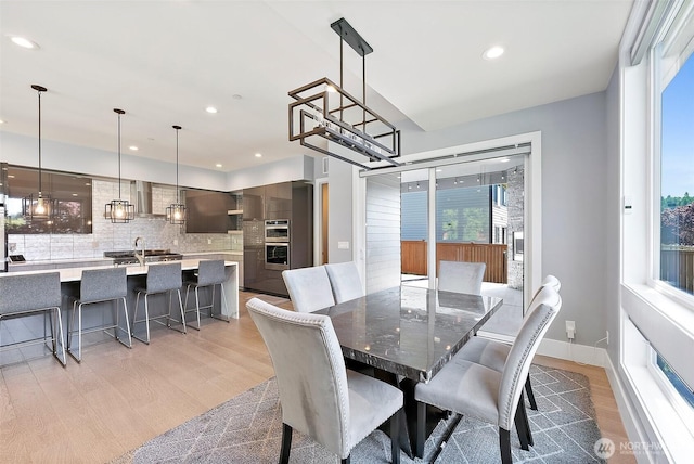 10501 Angeline Rd E, Bonney Lake, WA 98391 - dining area featuring light wood-type flooring, healthy amount of natural light, and recessed lighting