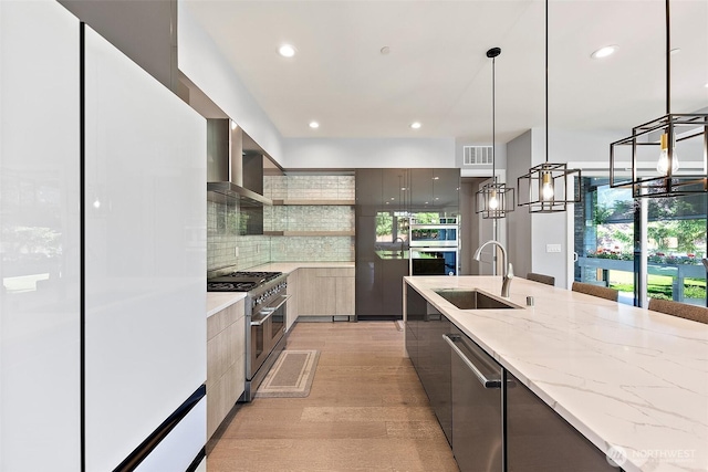 10501 Angeline Rd E, Bonney Lake, WA 98391 - kitchen featuring modern cabinets, appliances with stainless steel finishes, a sink, wall chimney exhaust hood, and open shelves