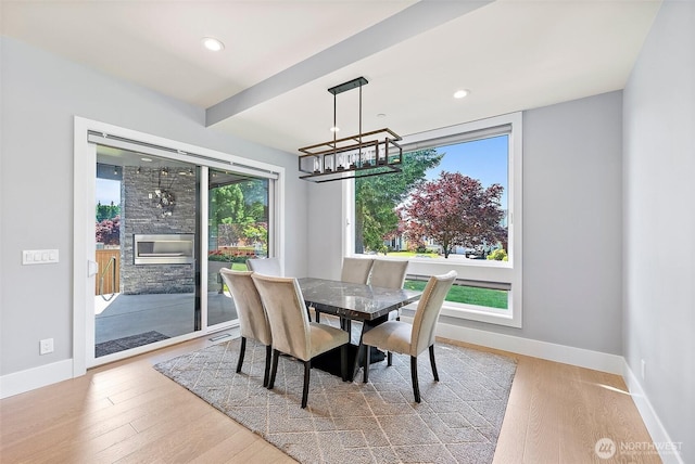 10501 Angeline Rd E, Bonney Lake, WA 98391 - dining area with a chandelier, wood finished floors, baseboards, and recessed lighting
