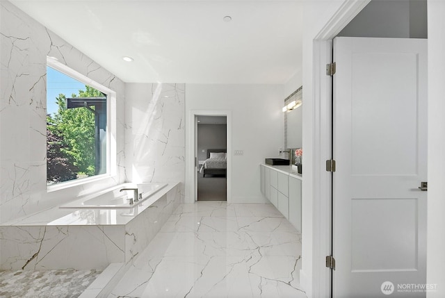10501 Angeline Rd E, Bonney Lake, WA 98391 - full bath featuring marble tiled floors, ensuite bathroom, a garden tub, vanity, and recessed lighting