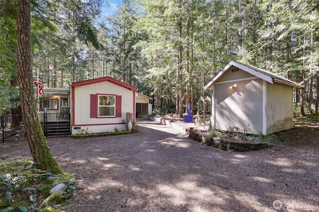 451 N Mount Jupiter Dr, Hoodsport, WA 98548 - view of shed with covered porch and driveway