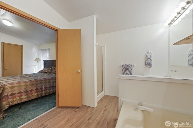 451 N Mount Jupiter Dr, Hoodsport, WA 98548 - ensuite bathroom with wood finished floors, a stall shower, and a tub