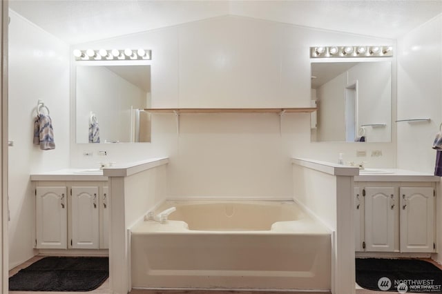 451 N Mount Jupiter Dr, Hoodsport, WA 98548 - full bathroom featuring a garden tub, two vanities, and lofted ceiling