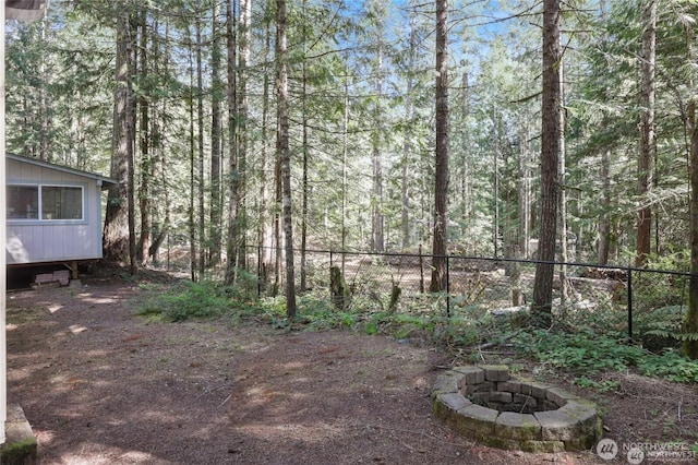 451 N Mount Jupiter Dr, Hoodsport, WA 98548 - view of yard featuring a fire pit and a forest view