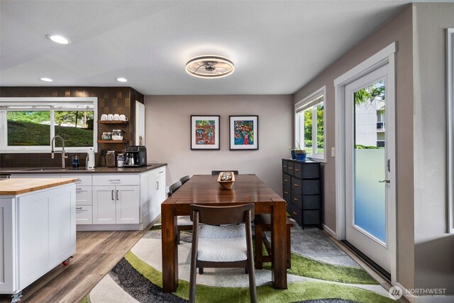7008 155th Pl NE, Redmond, WA 98052 - dining area featuring light wood-type flooring and recessed lighting