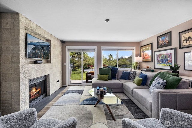 7008 155th Pl NE, Redmond, WA 98052 - living area featuring a large fireplace and wood finished floors