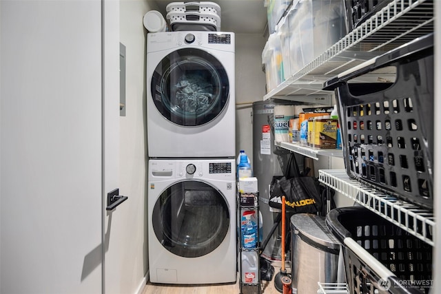 7008 155th Pl NE, Redmond, WA 98052 - laundry room with stacked washer and clothes dryer and wood finished floors