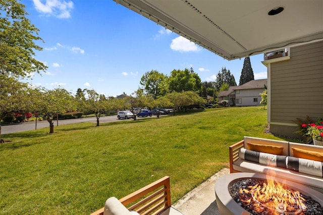 7008 155th Pl NE, Redmond, WA 98052 - view of green lawn with a fire pit