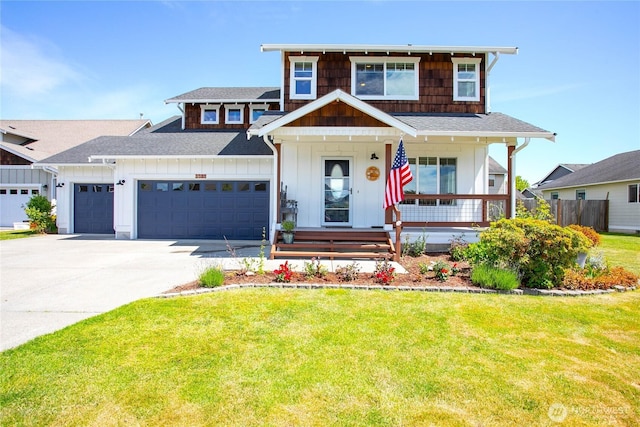 7328 Seashell Way, Blaine, WA 98230 - view of front of home with board and batten siding, a garage, concrete driveway, a front lawn, and a porch
