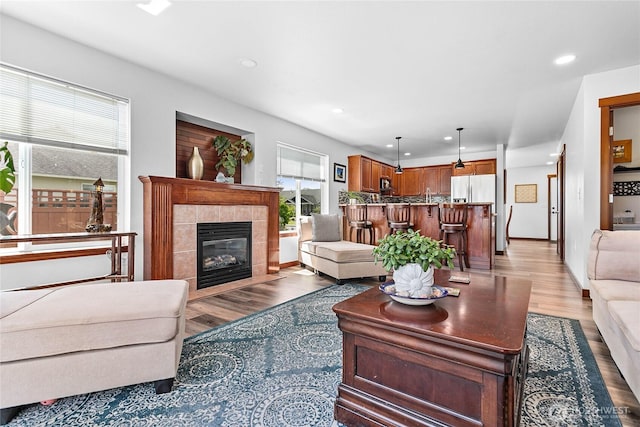 7328 Seashell Way, Blaine, WA 98230 - living room with light wood finished floors, a tile fireplace, and recessed lighting