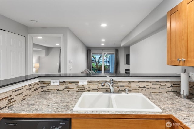 3318 30th Ave SW Unit B402, Seattle, WA 98126 - kitchen featuring a sink, tasteful backsplash, dishwashing machine, recessed lighting, and light countertops