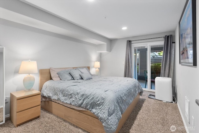 3318 30th Ave SW Unit B402, Seattle, WA 98126 - bedroom featuring light colored carpet, access to exterior, baseboards, and recessed lighting