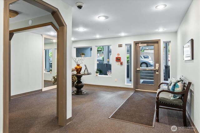 3318 30th Ave SW Unit B402, Seattle, WA 98126 - exercise area with dark carpet, baseboards, and recessed lighting